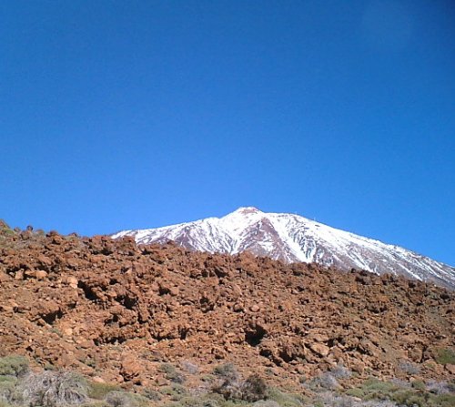 Snow-capped Mt Teide and volcanic rocks
