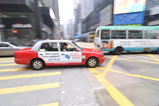 Panning shot of a red cab in Central of Hong Kong