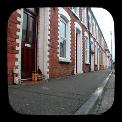 A Row of Terrace Houses with Doorsteps in need of Cleaning.