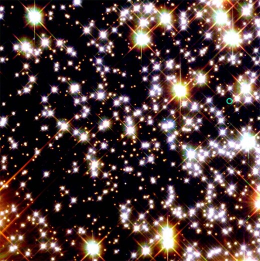 This field of stars taken by the Hubble telescope has a pulsar in it indicated by the blue circle to the right of the field.