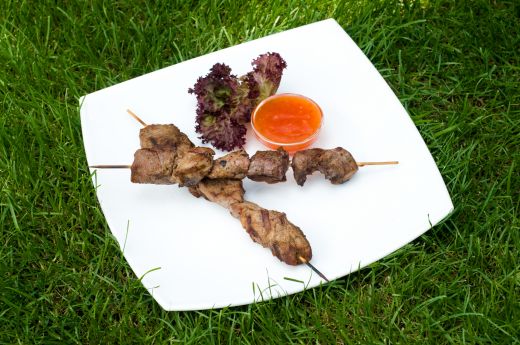 Grilled Meat on Sticks with Hot Sauce from Dreamstime.com