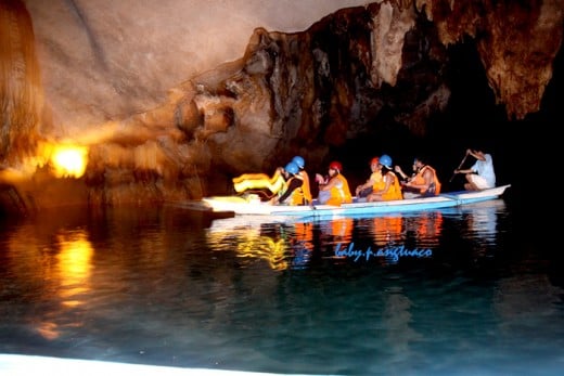 A paddle-boat with tourists like us navigating the underground river 