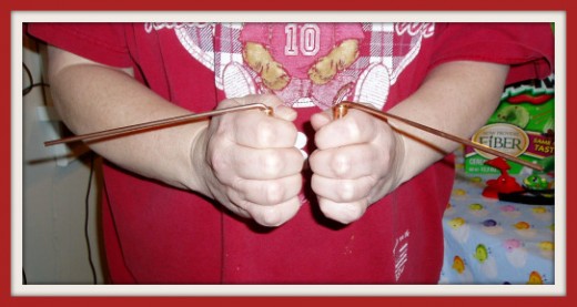 Dowsing rods in a "no" position for this dowser.  Photo by Jessica Gerber.