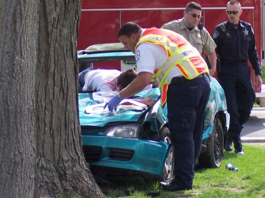 Paramedics attending to the critically injured student. 