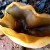 Another ear shaped mushroom growing in the same bed next to the brick border. Another ear shaped mushroom growing in the same bed next to the brick border.