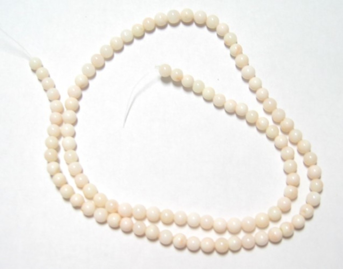 Very rare, pale pink coral bead - color known as "angel skin coral". This coral bead necklace is all natural and is a very even color.