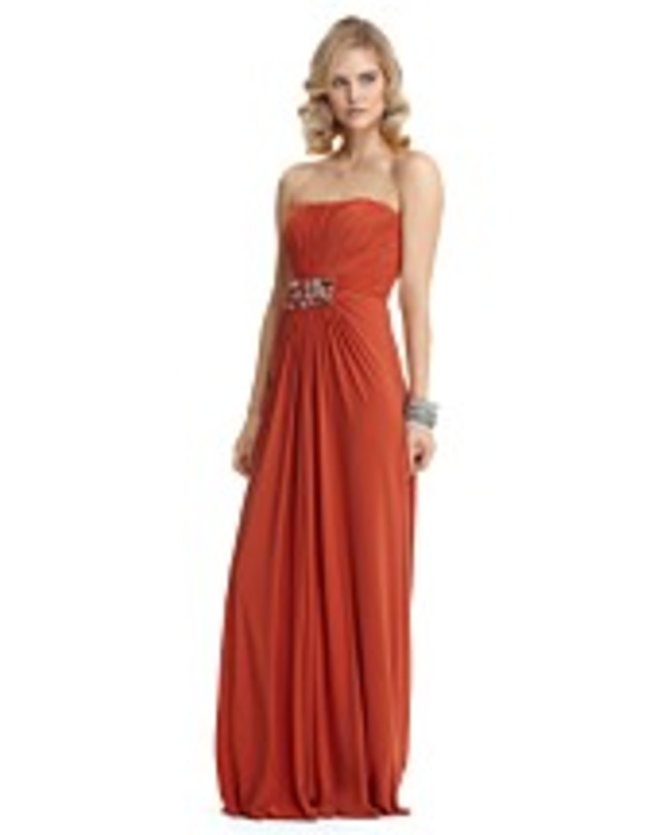 mignon chiffon strapless gown with beading, $368.00.   photo credit: bloomingdales.com  a ruched bodice is accentuated with a jeweled brooch, currently available in size 10 only, color= ginger