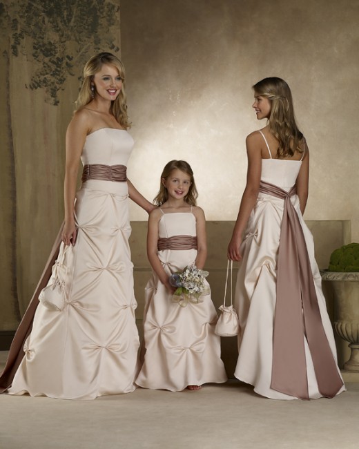Bridesmaid Dresses: Forever Yours Bridesmaids Dresses #78101 Lamore satinStrapless A-line gown with ruched waistband and pick-ups on the skirt. Long tails highlight the back