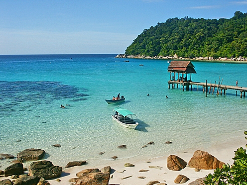 Enjoy swimming in the turquoise-blue sea at Perhentian