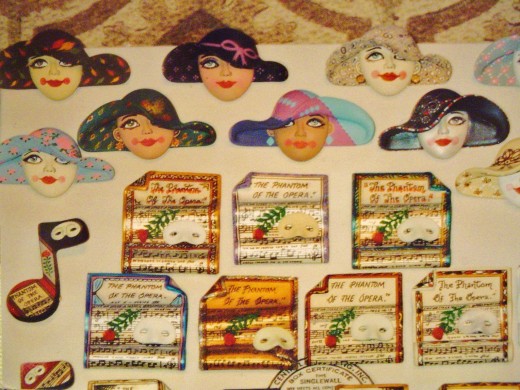 A variety of theatrical pins and ladies with hats