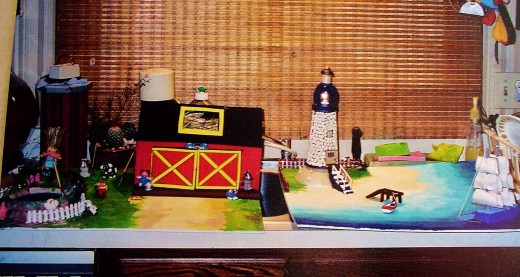 A farm in 3-D and A loghthous and harbor in 3_d..the farm was by a kindergardner, and the lighthouse was by a third grade boy.
