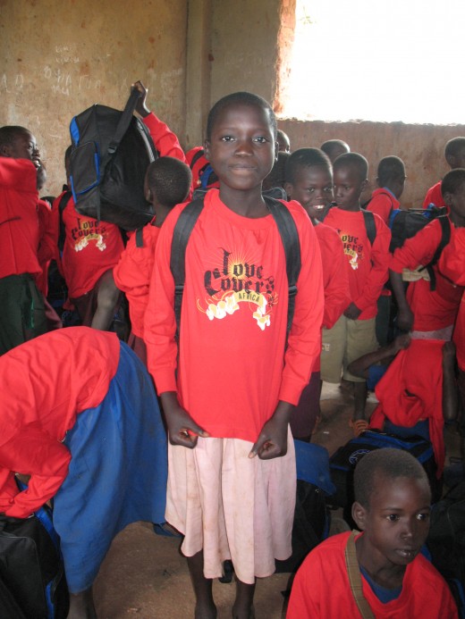 A girl proudly displaying her Love Covers t-shirt
