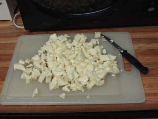 Cut up a block of tofu.
