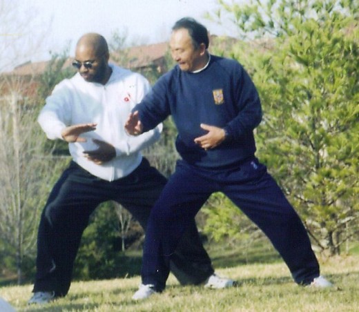 Here is agood example of the horse stance. Her Master Zhang Xuexin works with Sifu Herb Parran.