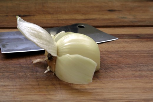 Step 3. Peel back the first layer of the onion, all the way to the back. Do not pull it off.