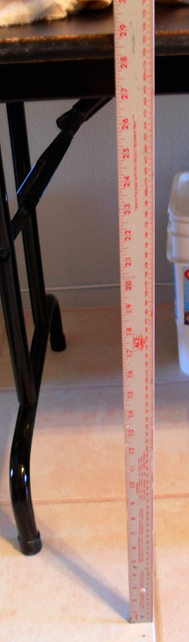 Measure the distance from the floor to the under side of the table top. This will be the length of the table skirt.
