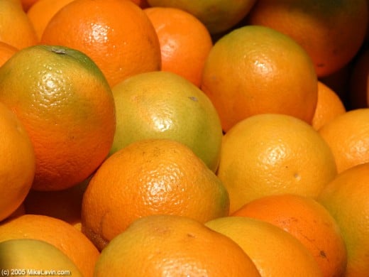 Real oranges are yellow orange and green in color.