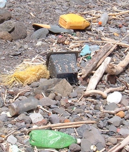 Assorted plastic items on a beach