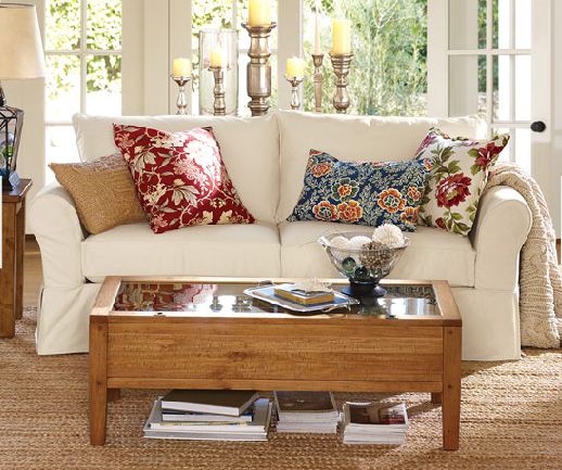 The pillows used on this sofa don't necessary follow the "rules" (except they all have some off-white), but because the rest of the room is very neutral it just works and it looks beautiful and cheery.