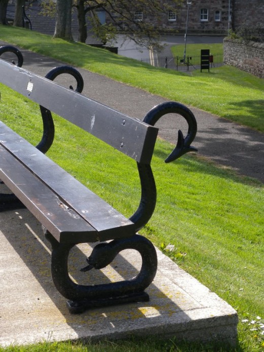 Such an ornate bench... a full snake made out of rod iron.