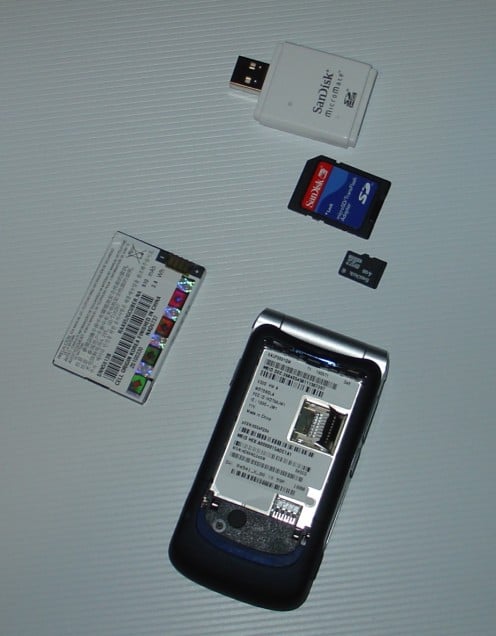 Here you see the phone, battery, and Micro SD card.  The two cards above it are adaptors to let it fit in my card reader.
