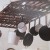 "Found" old gate used as a beautiful pot rack. "Found" old gate used as a beautiful pot rack.
