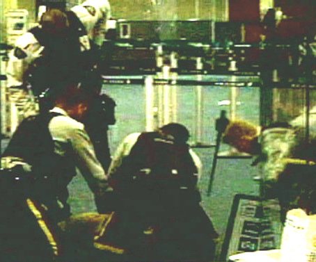 This still from a video shows Robert Dziekanski on October 14th, 2007 lying on the ground in his death throes after being tasered for the fifth time. After becoming disoriented at the Vancouver Airport and got distraught, the RCMP responded with dead
