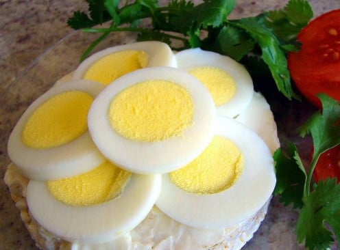 Perfect thin slices of a perfectly-cooked hard boiled egg.