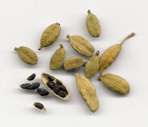 Cardamom pods, that are housing the tiny black seeds. 