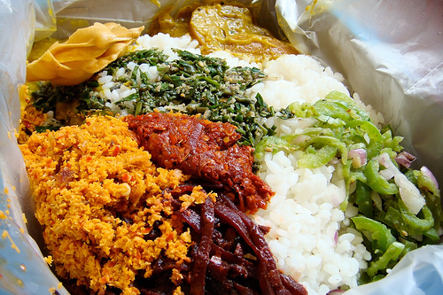 Sri Lankan rice with curry, pickles, sambol and mallung
