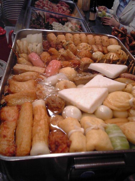 oden mostly seafoods cooked similar in Japan cosisting of meatballs tofu, boiled eggs and radish, pickled