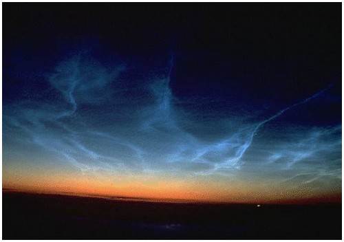 This photo shows a twilight occurrence of noctilucent clouds. These clouds are becoming increasingly common due to methane breakdown and hydrogen sulfide rising high into the atmosphere.