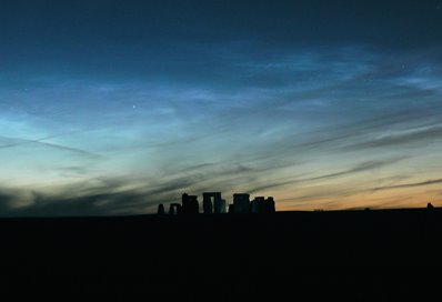 This is another example of noctilucent clouds, again seen near the daylight-darkness terminator. The glow is caused by the photoelectric effect at the blue end of the visible spectrum for hydrogen.