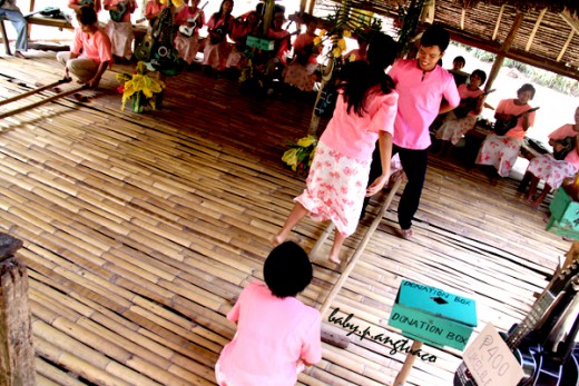 Performers doing the "tinikling" or bamboo dance