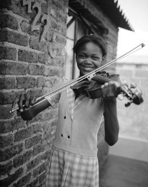 A young violinist from Soweto. Photo from the BuskAid Facebook site.