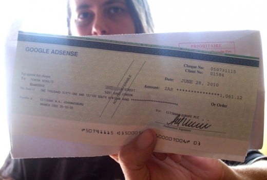 Me in South Africa, holding my 3rd Google Adsense cheque.