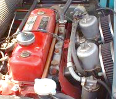 As I remember there were 2 SU Carburetors on most Jaguar and MG engines during that time