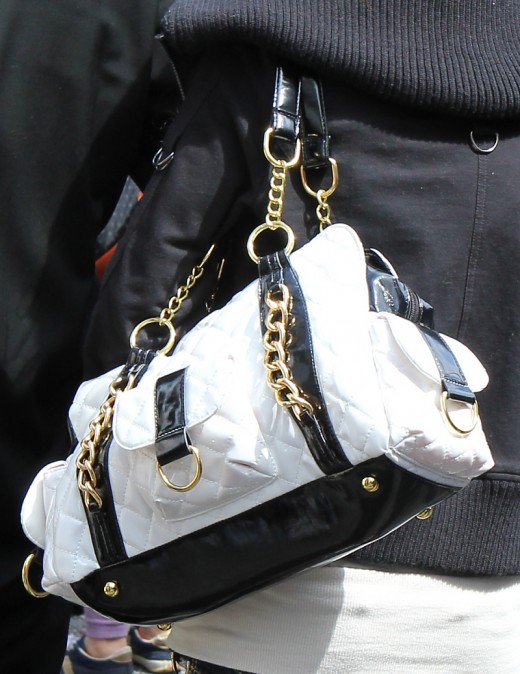 In Japan about the only rule for handbags is that they must be BIG! A black and white bag is just as eye catching as a colored bag. Just remember it might be difficult to find your iPod Nano in such a big bag!