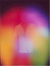 Here is a Kirlian photograph of a human aura.  Note the person in the middle.  The colours are representative of his or her character.  As you can see, we're not wholly contained within our physical bodies