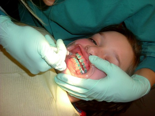 Patient being operated, for placement of braces.