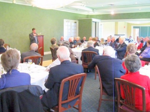The writer speaking to an after-dinner audience.  Over the past fifteen years he has been a guest speaker nearly 650 times, and around 36,000 people have heard him speaking during this time.