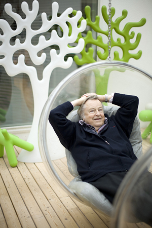 Eero Aarnio In His Famous Hanging Bubble Chair