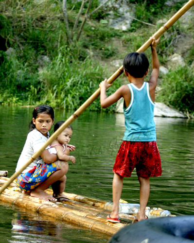 bamboo pole and raft framing the children