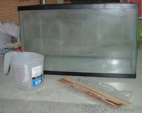 Used an old aquarium for the mold.  Bought some cheap measuring cups to mix in. The stir sticks were free.