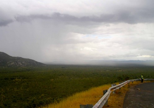 Curtains of rain moving across a deserted landscape