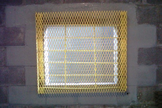 I finally completed restructuring of the rear warehouse window at work. I added the new screen, squared everything up, and painted it safety yellow. Painting the concrete block wall gray was an afterthought. 