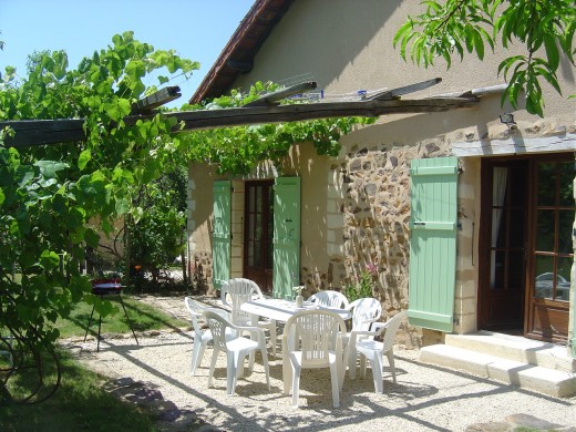 The gite has a southeast facing terrace for morning sun. It is shaded with grape vines.
