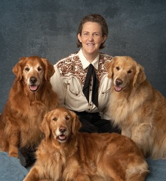 Temple Grandin surrounded by the animals she loves.