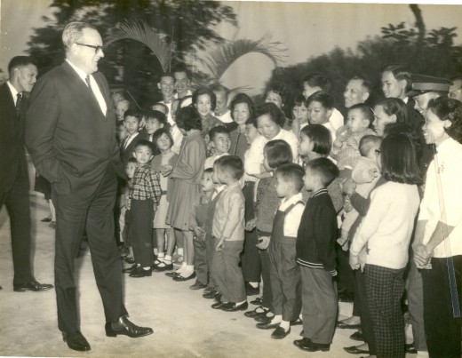 Governor Trench meeting staff and family members - Dad was the tallest man standing at the back, my brother, Man, was in the 1st roll wearing a checkered shirt.