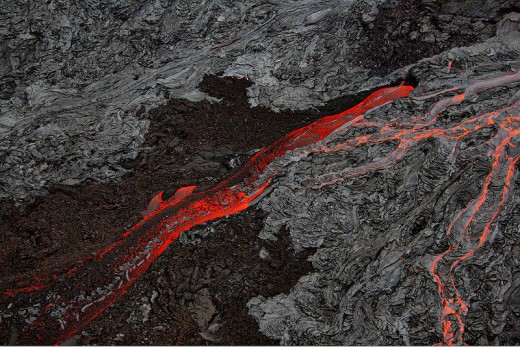 A'a lava flowing along with, Pahoehoe lava.